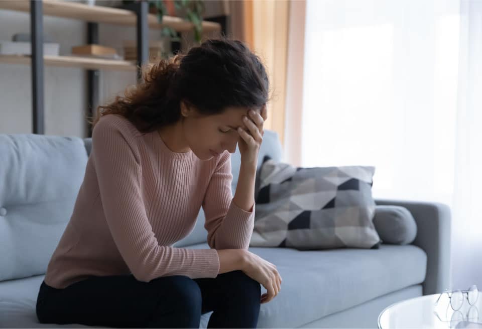 Woman suffering thom an anxiety attack