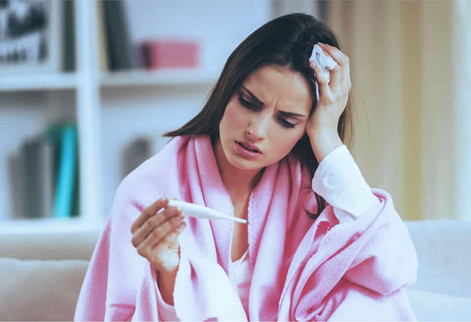 Woman Checking Digital Thermometer