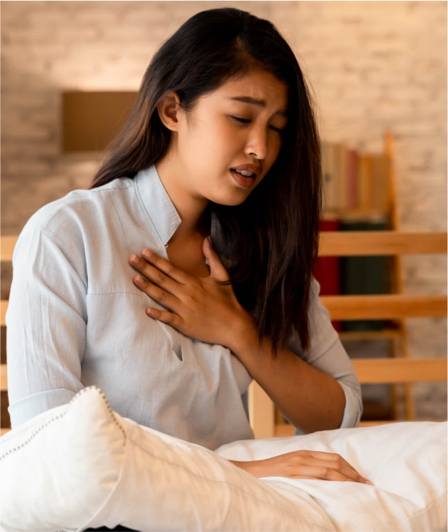 Young woman suffering from an asthma attack